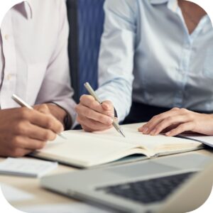 mid-section-two-colleagues-brainstorming-making-notes